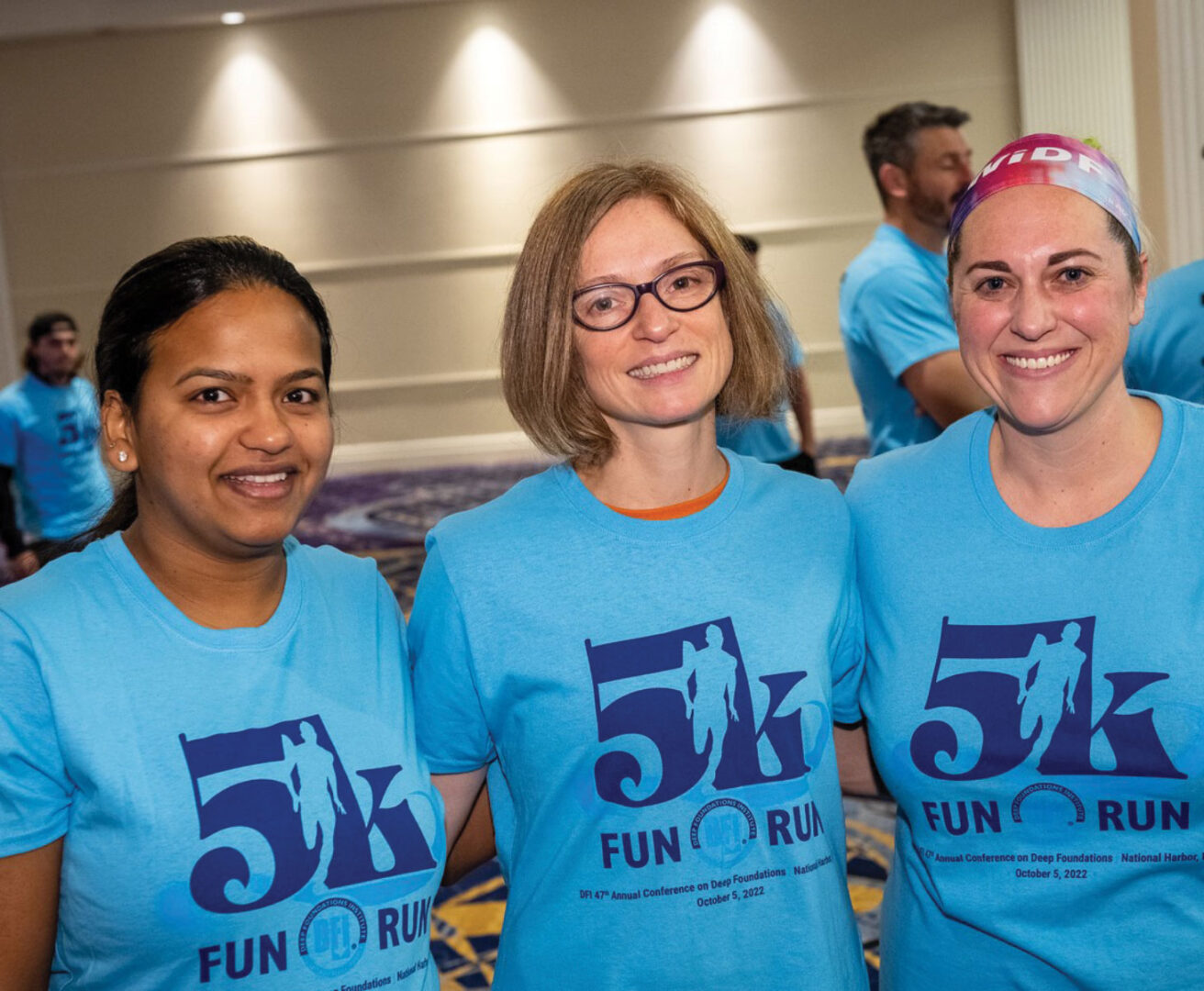 Carol Domitric and two colleagues wearing blue 5K Fun Run tshirts