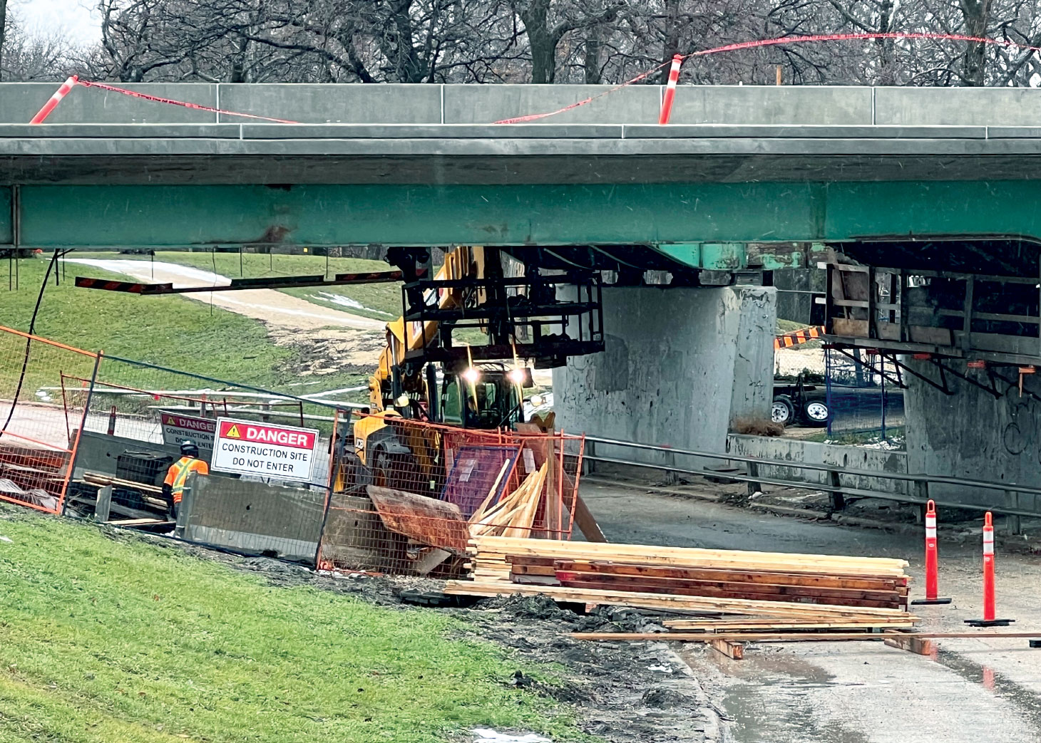 Workers working below St. Vital bridge