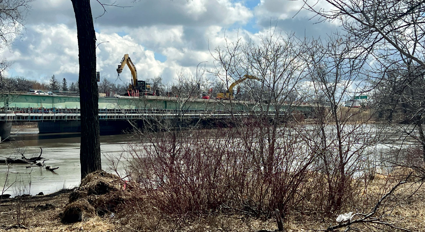 Heavy equipment working on St. Vital bridge