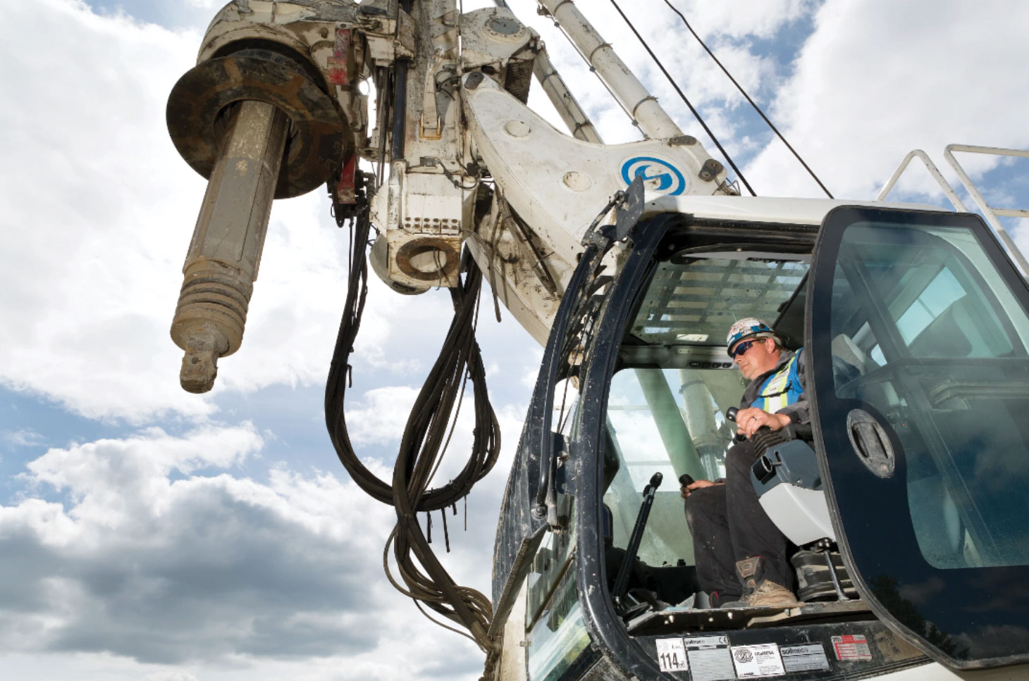 Operator sitting in drill rig.