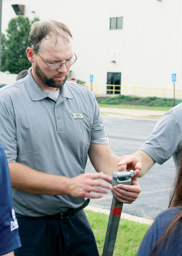 Man inspecting drill