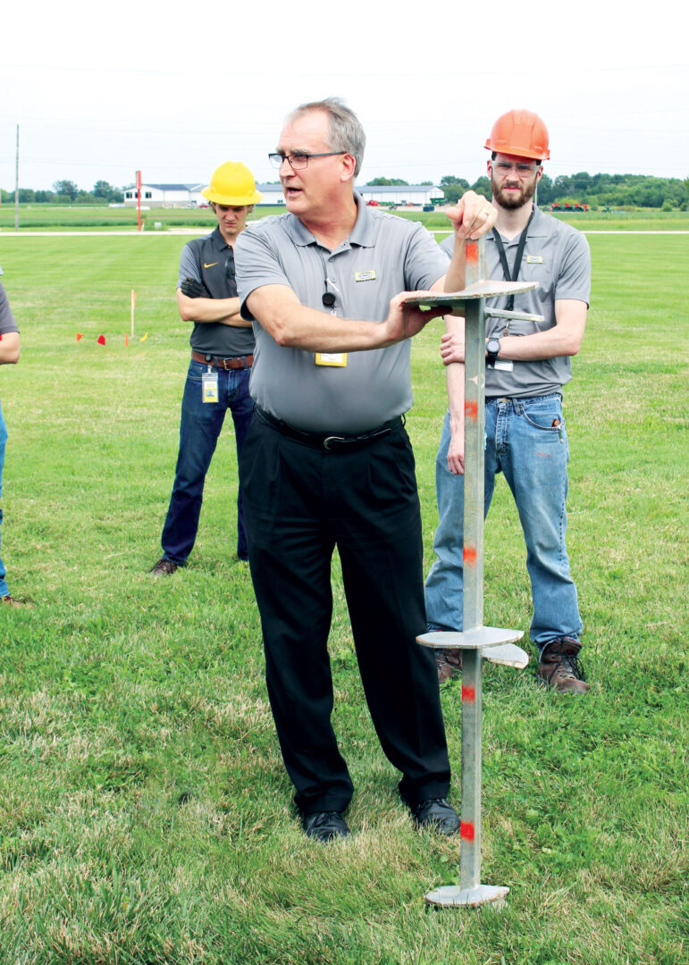 Man holding large drill