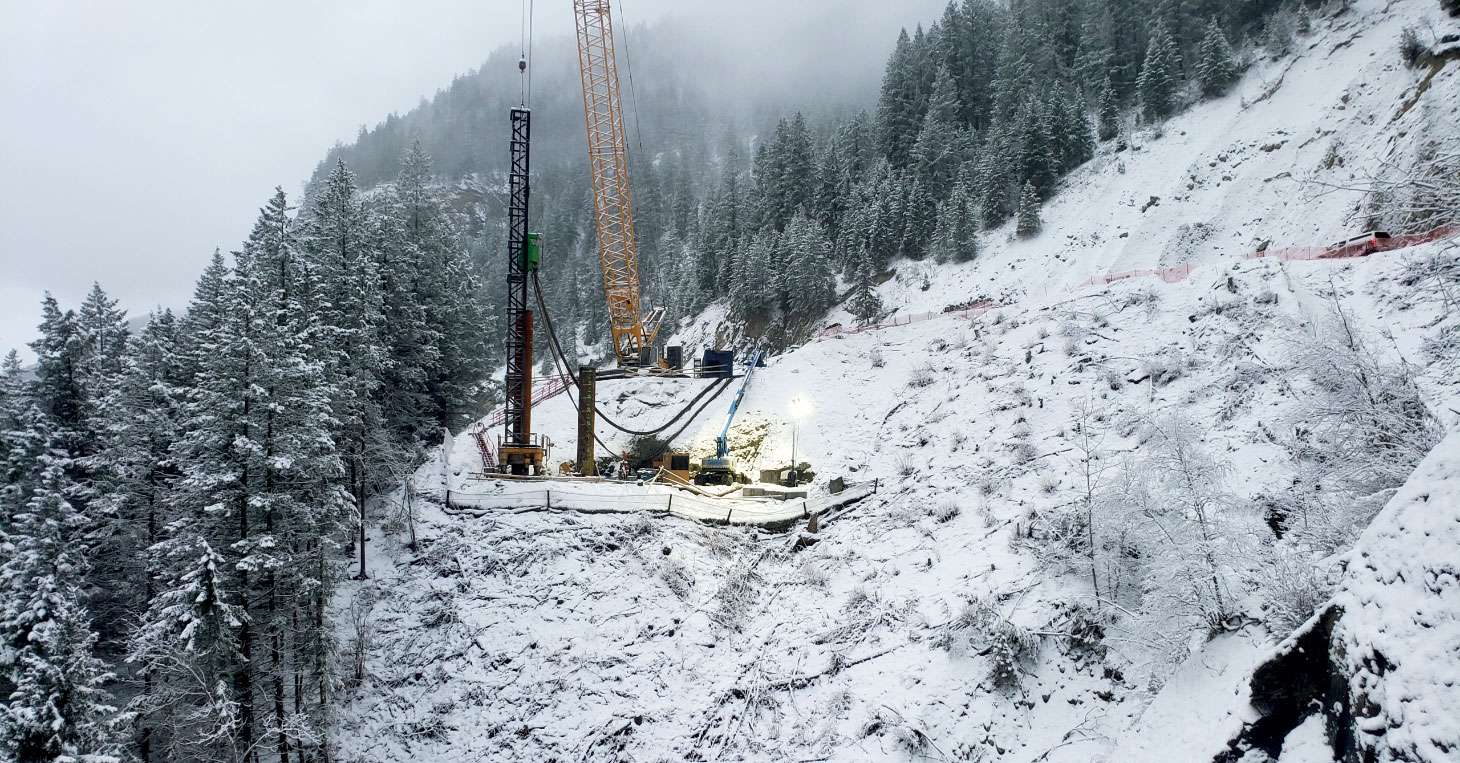 Construction on snow-covered mountainside