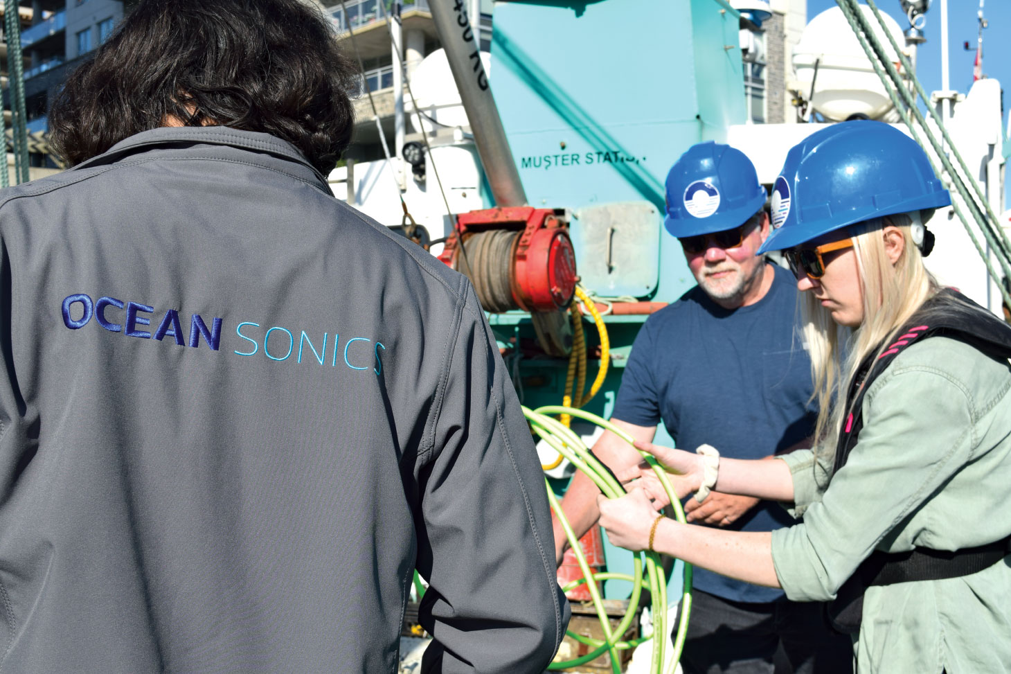 Ocean Sonic team working, wearing blue hard hats