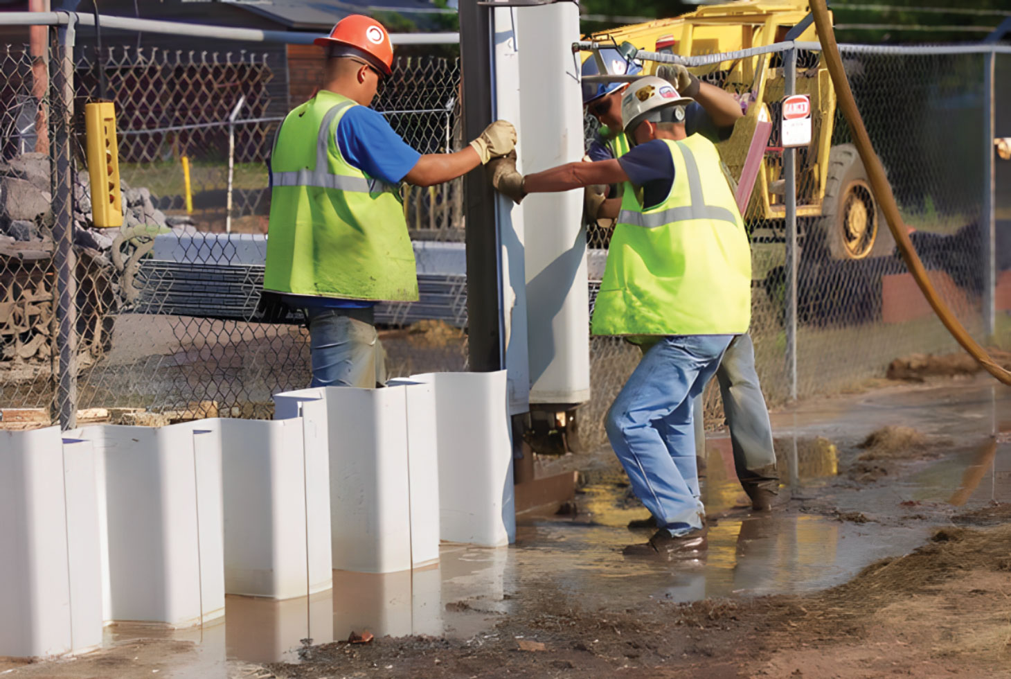 Two men installing sheet wall