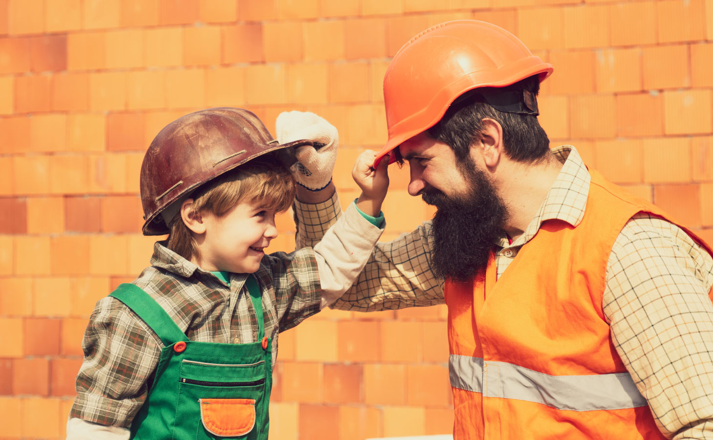 A boy and a man at a construction site