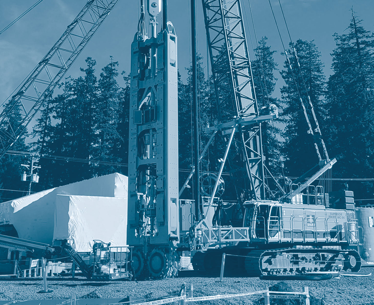 Photo of Pile driving equipment with blue tint overlay